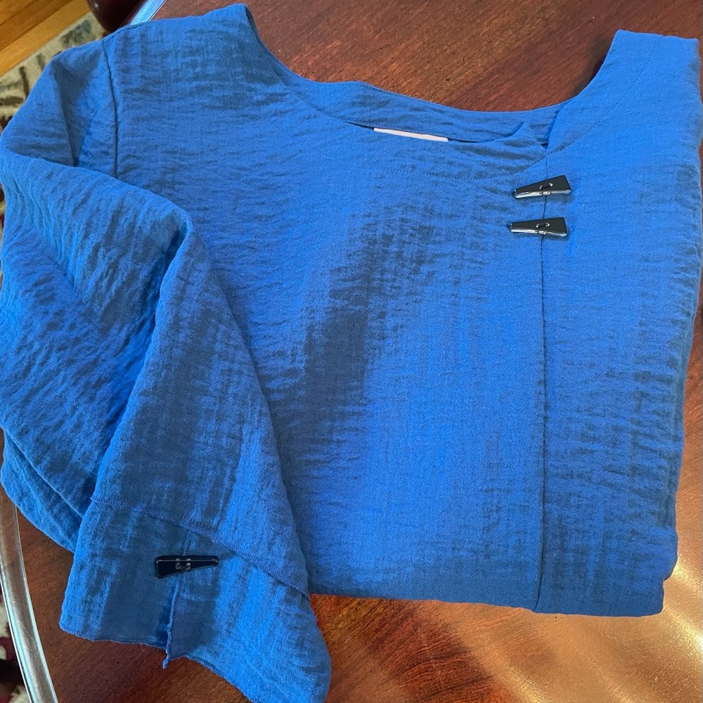 Jewel blue mandarin style lightweight top with black button accents.